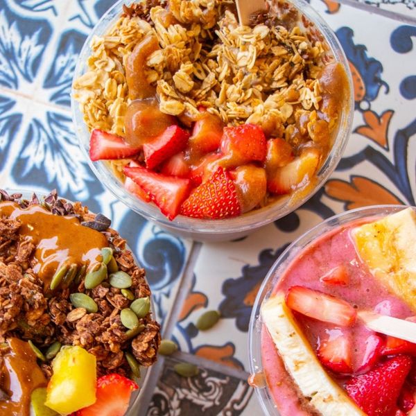 A table with different acai bowls.