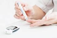 person pricking finger Diabetes specialized care