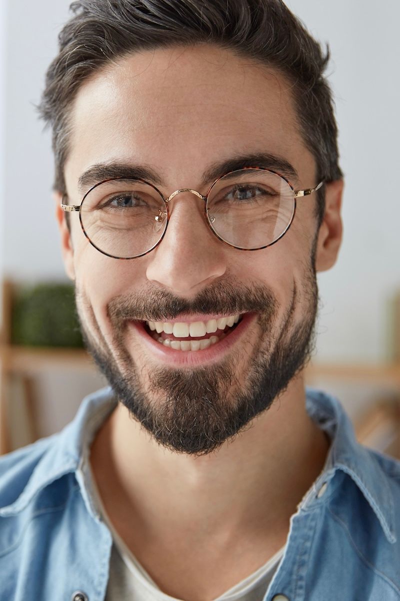 A cheerful man with a new haircut