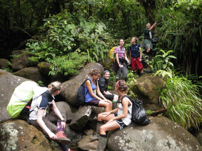 hikers relaxing in rainforest at la danta