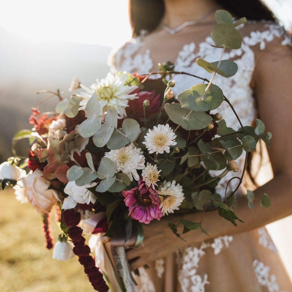 beautiful-wedding-bouquet-made-eucalyptus-colorful-flowers-girl-s-hands-outdoors-sunny-day.jpg