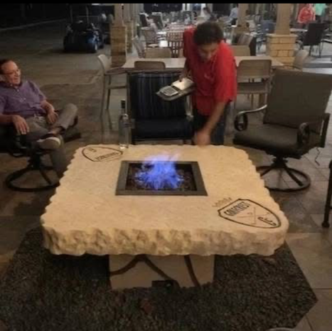 Custom engraved boulder fire pit table by Boulder Designs