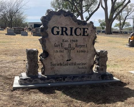 Affordable gray and black upright memorial headstone engraved with names, dates, and scripture