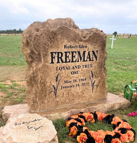 Affordable tan upright memorial headstone engraved with name, dates, and decorative wheat