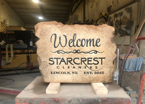 Custom carved stone welcome sign for Starcrest Cleaners in Lincoln Nebraska