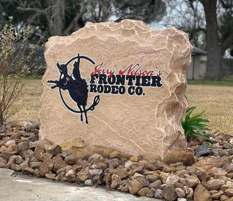 Custom crafted Frontier Rodeo Company commercial boulder sign