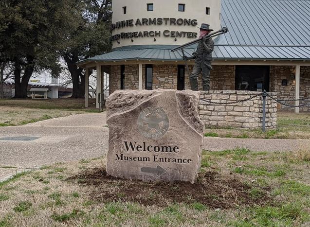 Custom engraved and etched stone welcome museum entrance boulder sign
