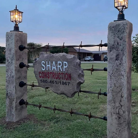 Custom Engraved Entrance Boulder Sign Mounted in Decorative Fence for Residential and Commercial Property – Sharp Construction