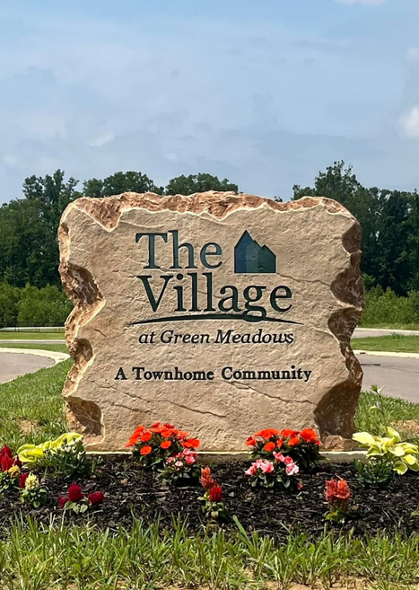 Custom engraved and etched stone commercial entrance sign for The Village at Green Meadows