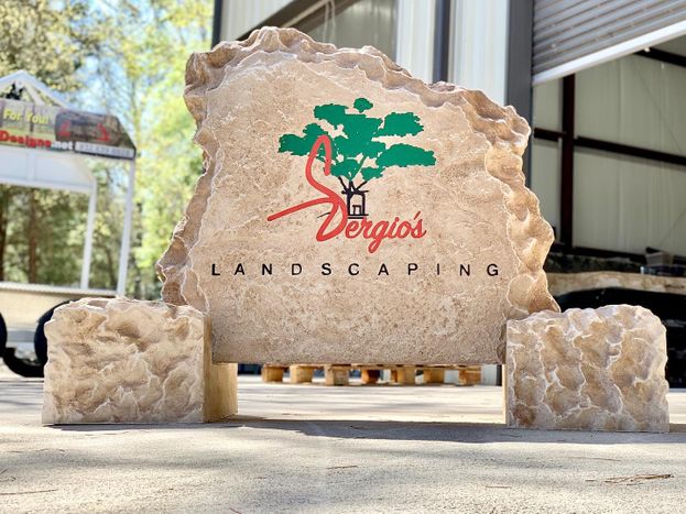 Custom carved stone commercial business monument sign for Sergios Landscaping