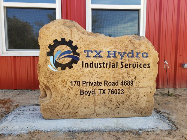 Custom crafted commercial TX Hydro Industrial Services boulder monument sign