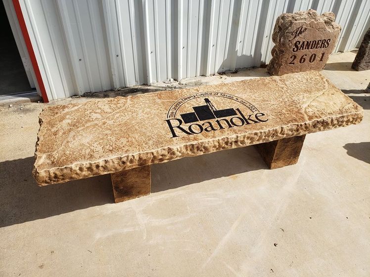 Custom engraved decorative boulder bench featuring Roanoke, Texas seal