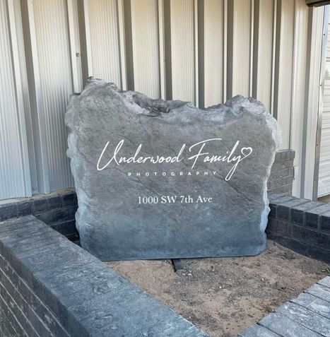 Custom engraved business boulder sign reading Underwood Family Photography with address 1000 SW 7th Ave.