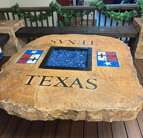 Custom engraved Texas boulder fire pit table by Boulder Designs