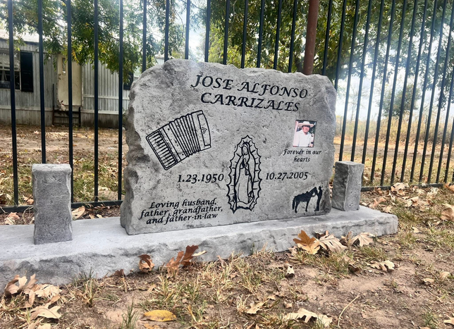 Affordable gray memorial headstone engraved with accordion, Virgin Mary, and portrait