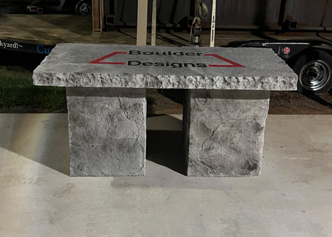 Custom engraved boulder-style stone bench by Boulder Designs
