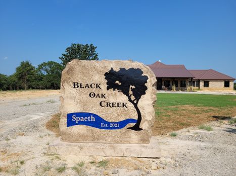Black Oak Creek personalized engraved landscape boulder entrance sign