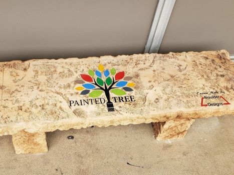 Custom engraved Painted Tree boulder-style bench by Boulder Designs