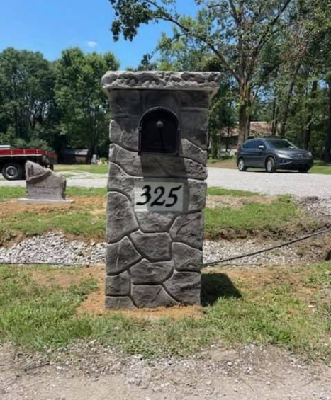 Decorative stone mailbox column with address numbers by Boulder Designs