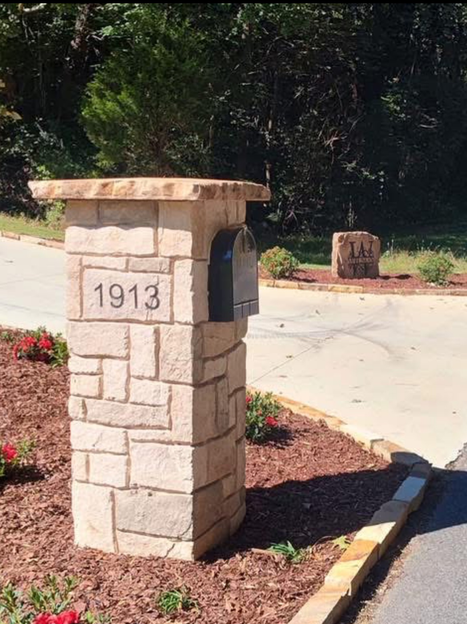 Custom crafted engraved stone mailbox pillar with address numbers
