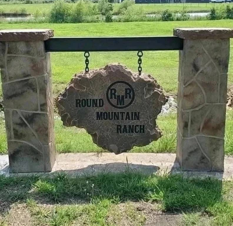 Custom engraved hanging stone sign for Round Mountain Ranch entrance
