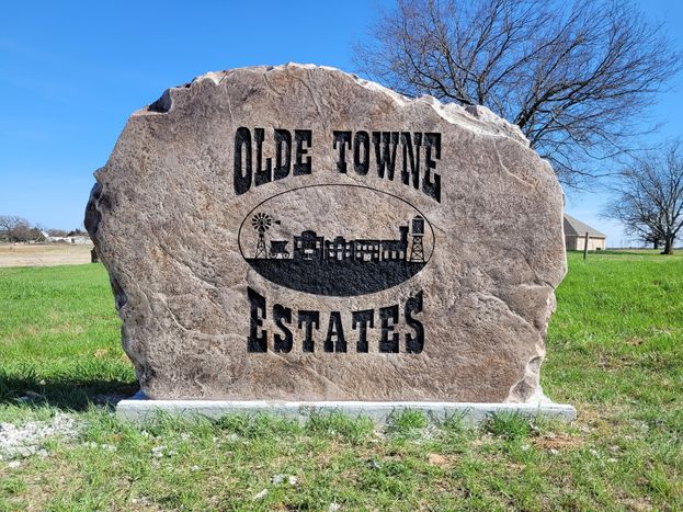Custom crafted Olde Towne Estates boulder monument entrance sign