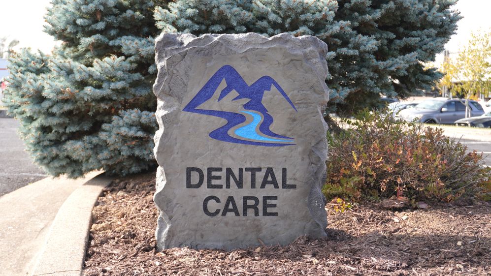 Custom engraved and etched stone commercial monument sign for Dental Care in Harrisonburg VA, created by Angelopulos StoneCraft