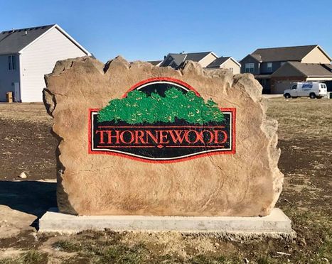 Custom engraved and etched stone commercial entrance sign for Thornewood neighborhood