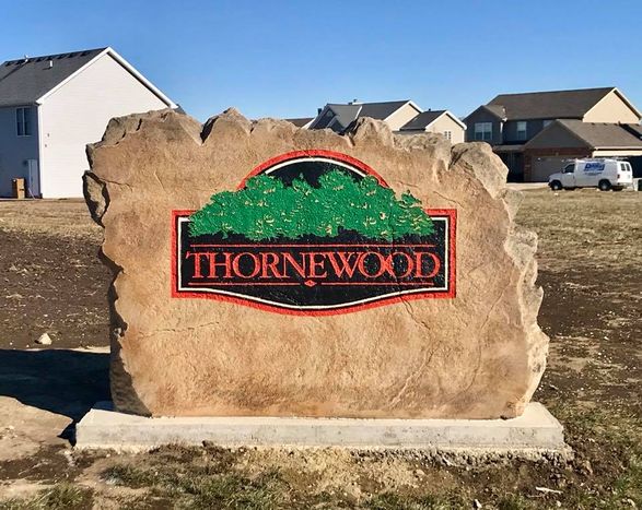 Custom engraved and etched stone commercial entrance sign for Thornewood neighborhood