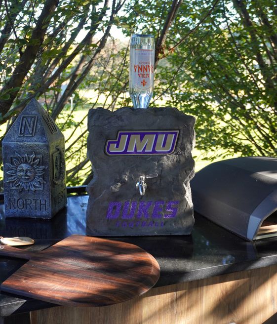 Custom engraved JMU Dukes decorative boulder with built-in tap created by Angelopulos Stonecraft