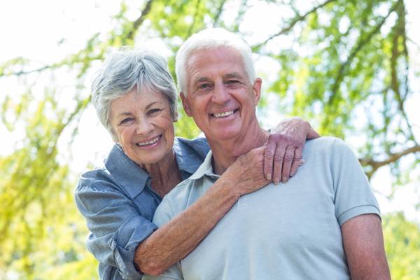 Couple smiling and holding each other