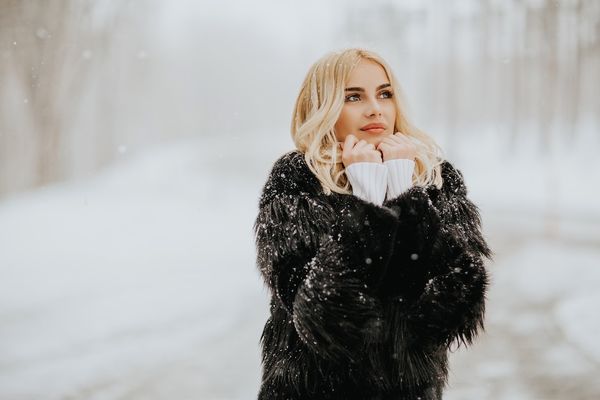 blonde-woman-outside-in-snow-winter-coat-2023-11-27-05-10-20-utc.jpg