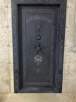 Installed Custom Steampunk Magnum Vault Door with custom text and a skull logo.