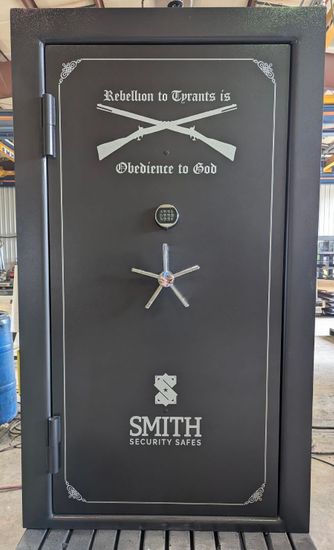 Grey Elite Vault Door with Custom rifle graphics and text with the Smith Security Safes logo at the bottom. Grey Elite Vault Door with Custom rifle graphics and text with the Smith Security Safes logo at the bottom.