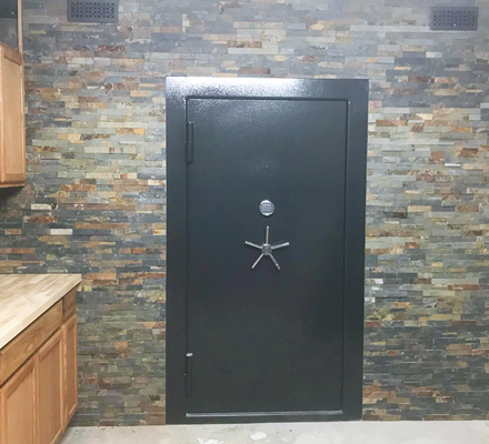 A safe door installed in a finished basement