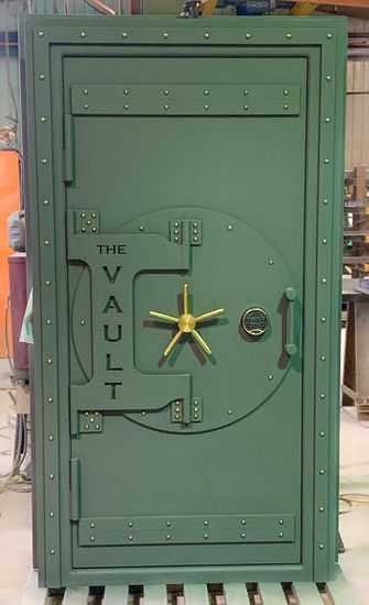 Custom Green Vintage Steampunk Vault Door with a gold handle.