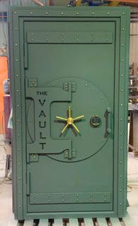 Green Steam punk finished vault door with the words The Vault engraved in the front. Green Steam punk finished vault door with the words The Vault engraved in the front.
