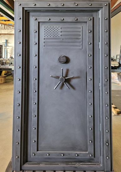 Grey Steampunk Vault door with an American flag engraved in the door.