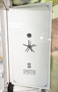 White gloss vault door with Smith Security Safes logo at the bottom. White gloss vault door with Smith Security Safes logo at the bottom.