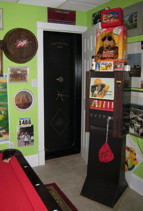 the inside of a vault room that has green walls and nostalgic memorabilia. the inside of a vault room that has green walls and nastolgic memorabilia.