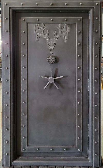 Titan Vault door with steampunk finish and a deer skull engraving