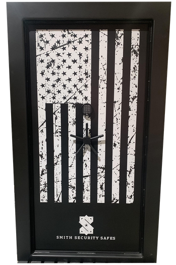 This featured Magnum Vault Door combines heavy-duty protection with a bold custom design. Built with a solid 1/2" steel protective door skin, a formed channel frame designed to “clamshell” the wall for added security, and upgraded 1.5" stainless steel locking pins, the Magnum delivers serious strength and reliability. This custom build features a sleek matte black finish with matching matte black handles and locks for a clean, modern look. The large American flag graphic and Smith logo create a striking patriotic design that stands out while maintaining a refined appearance. Available across multiple vault door series, this style can be customized with different finishes, graphics, hardware, and security options to create a truly one-of-a-kind vault door. Magnum Vault Door
