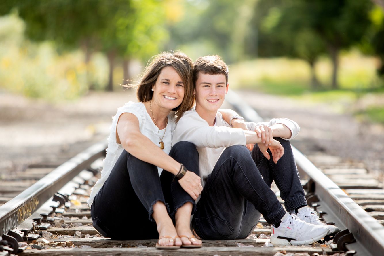 Mom and son sitting together in a photo shoot at REI.