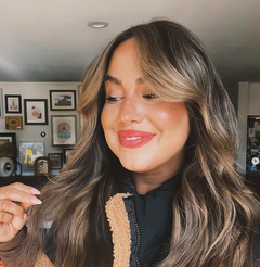 Leah F. smiling and flipping her flawless extensions by Heather at GROW Hair Lounge in Midtown Atlanta. Leah five‑star extension mastery review