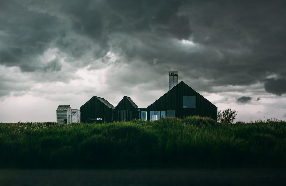 black-and-white-house-under-thick-clouds-833192.jpg