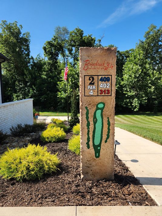 Stone Pillar Hole 2 Par 4 tee sign