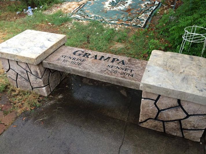 Stone memorial bench with pillars