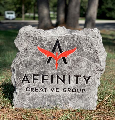 Company name and logo in stone
