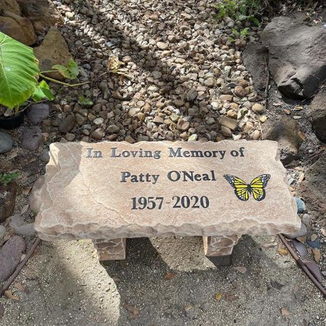 Engraved stone memorial bench with graphic