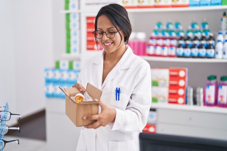 Pharmacist holding a package Home Delivery